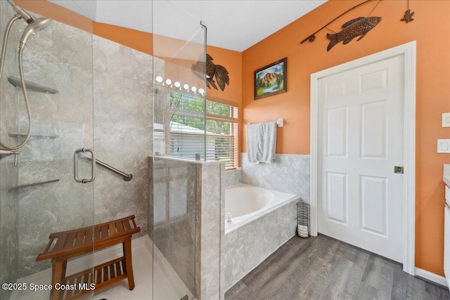 1160 Waco Blvd SE, Palm Bay, FL 32909 - bathroom featuring wood finished floors, a shower stall, and a garden tub