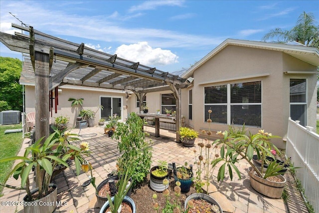 1160 Waco Blvd SE, Palm Bay, FL 32909 - rear view of property with a pergola, stucco siding, a patio, and central air condition unit