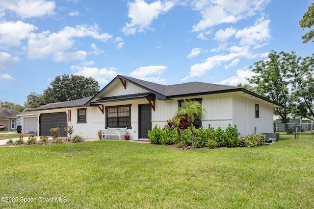 5460 Holden Rd, Cocoa, FL 32927 - view of front of property featuring an attached garage, driveway, central AC, and roof with shingles