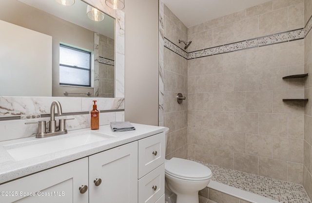 5460 Holden Rd, Cocoa, FL 32927 - bathroom with vanity, tiled shower, and toilet