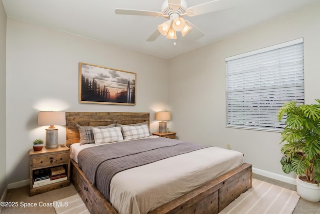 5460 Holden Rd, Cocoa, FL 32927 - carpeted bedroom with baseboards and a ceiling fan