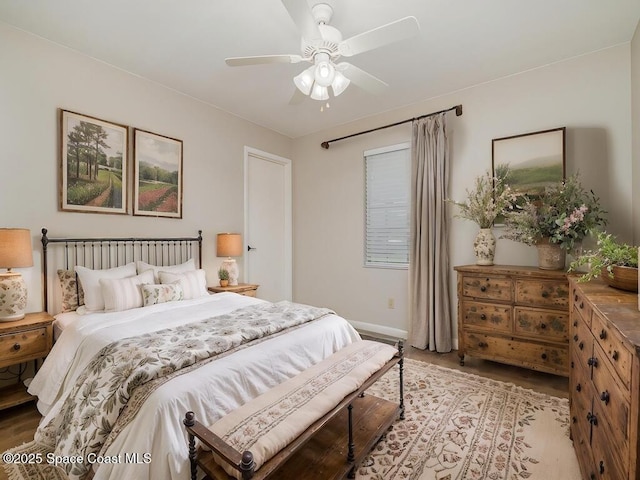5460 Holden Rd, Cocoa, FL 32927 - bedroom featuring wood finished floors, baseboards, and a ceiling fan