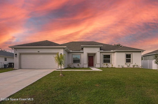 1717 Dalroy St NW, Palm Bay, FL 32907 - prairie-style house with an attached garage, stucco siding, concrete driveway, a shingled roof, and central AC unit