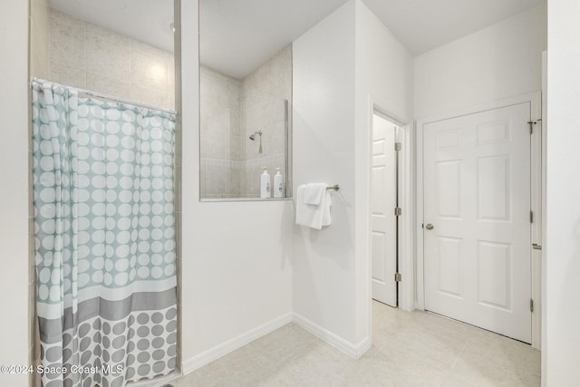 1717 Dalroy St NW, Palm Bay, FL 32907 - full bath with tiled shower, tile patterned flooring, and baseboards