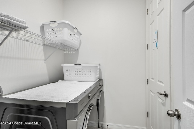 1717 Dalroy St NW, Palm Bay, FL 32907 - laundry area featuring independent washer and dryer and baseboards