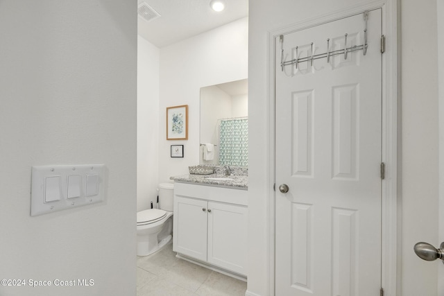 1717 Dalroy St NW, Palm Bay, FL 32907 - full bath featuring toilet, vanity, and tile patterned floors