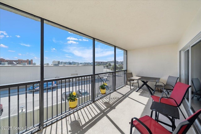 121 Lancha Cir Unit 206, Indian Harbour Beach, FL 32937 - sunroom featuring a city view