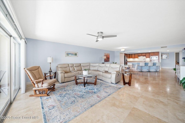 121 Lancha Cir Unit 206, Indian Harbour Beach, FL 32937 - living area featuring a ceiling fan