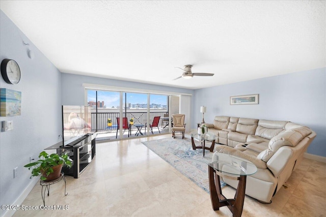 121 Lancha Cir Unit 206, Indian Harbour Beach, FL 32937 - living area featuring a ceiling fan and baseboards
