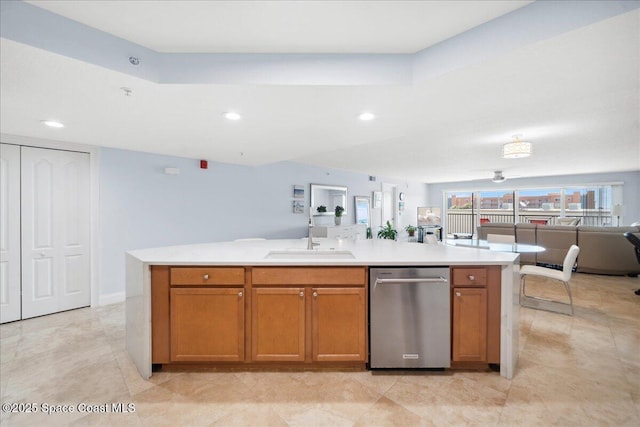 121 Lancha Cir Unit 206, Indian Harbour Beach, FL 32937 - kitchen featuring dishwasher, open floor plan, a sink, light countertops, and brown cabinetry