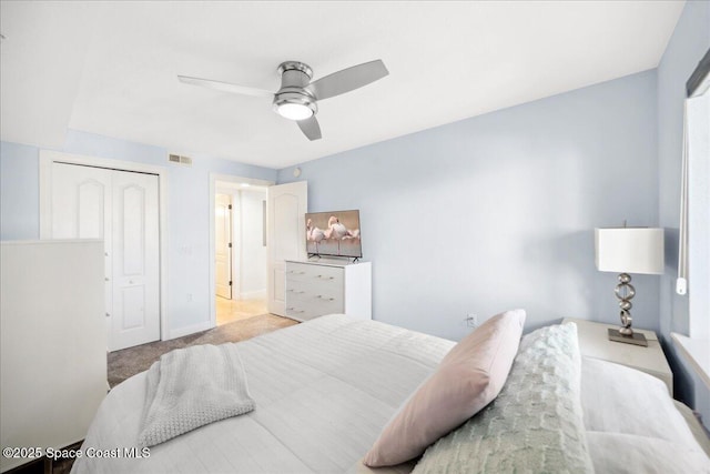 121 Lancha Cir Unit 206, Indian Harbour Beach, FL 32937 - carpeted bedroom with ceiling fan, baseboards, and a closet