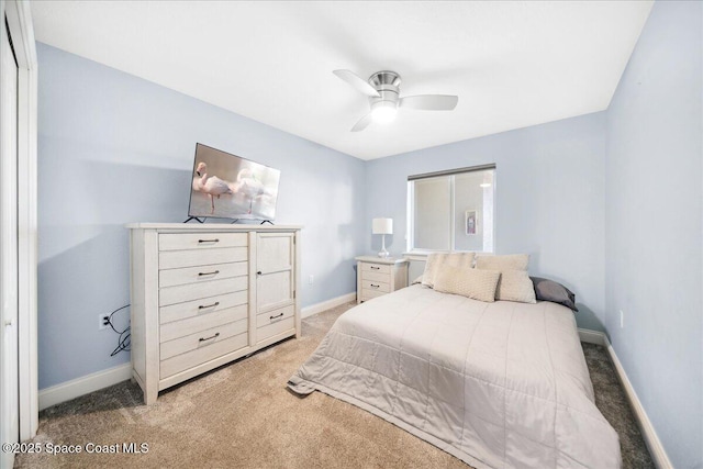 121 Lancha Cir Unit 206, Indian Harbour Beach, FL 32937 - bedroom with light carpet, baseboards, and ceiling fan