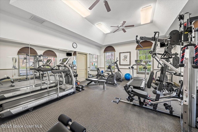 121 Lancha Cir Unit 206, Indian Harbour Beach, FL 32937 - workout area with a ceiling fan, a textured ceiling, and lofted ceiling