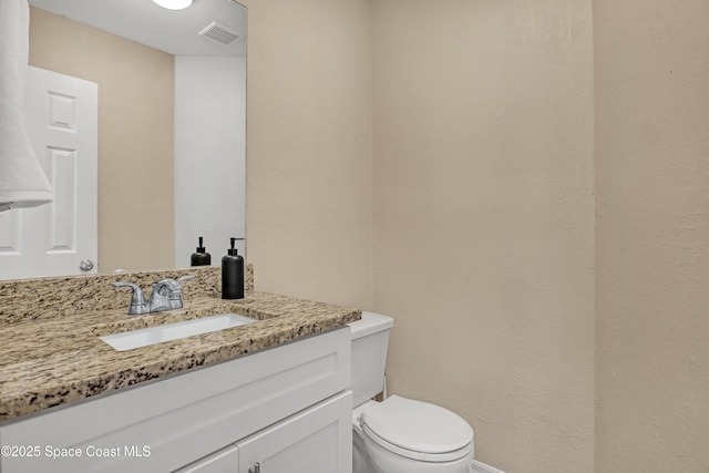 6827 Dodge Rd, Cocoa, FL 32927 - half bath featuring vanity, toilet, and baseboards