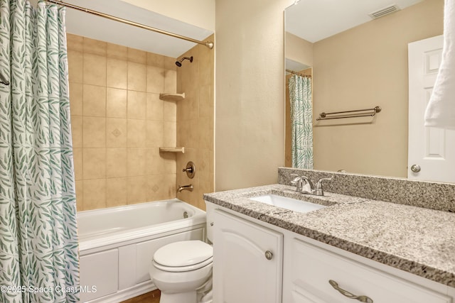 6827 Dodge Rd, Cocoa, FL 32927 - full bathroom featuring vanity, shower / bath combo with shower curtain, and toilet