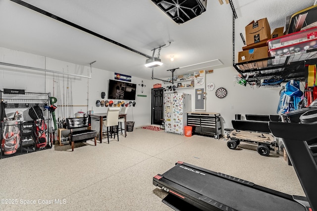 1460 Glendale Ave NW, Palm Bay, FL 32907 - garage with a garage door opener and electric panel