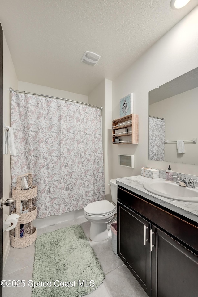 1460 Glendale Ave NW, Palm Bay, FL 32907 - full bathroom featuring vanity, toilet, a textured ceiling, shower / bathtub combination with curtain, and tile patterned flooring