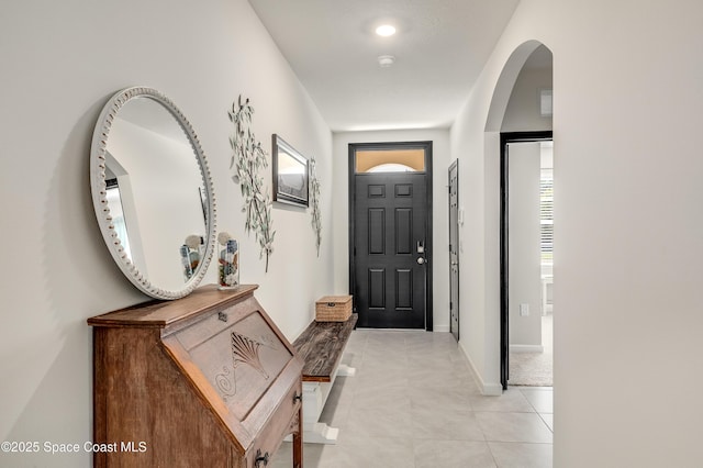 1460 Glendale Ave NW, Palm Bay, FL 32907 - entrance foyer featuring arched walkways, light tile patterned floors, and baseboards
