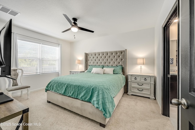 1460 Glendale Ave NW, Palm Bay, FL 32907 - bedroom with light carpet, baseboards, and a ceiling fan