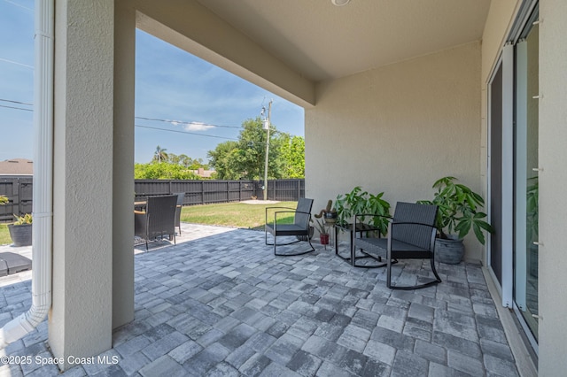 1460 Glendale Ave NW, Palm Bay, FL 32907 - fenced backyard with a patio