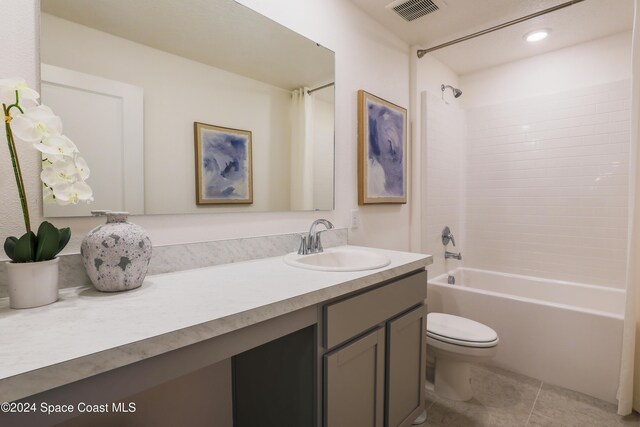 817 Redrock St SE, Palm Bay, FL 32909 - bathroom featuring tile patterned flooring, vanity, toilet, and shower / bath combination