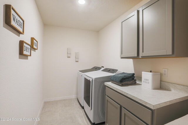 817 Redrock St SE, Palm Bay, FL 32909 - washroom with washer and clothes dryer, cabinet space, baseboards, light tile patterned floors, and recessed lighting