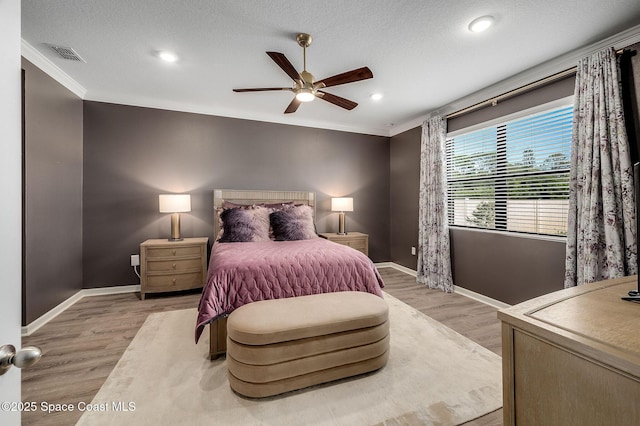 738 Old Country SE, Palm Bay, FL 32909 - bedroom with baseboards, ornamental molding, light wood finished floors, recessed lighting, and ceiling fan
