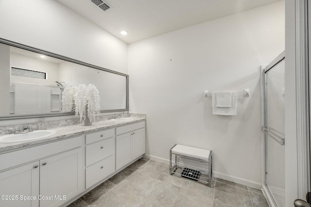738 Old Country SE, Palm Bay, FL 32909 - bathroom with double vanity, a stall shower, and baseboards
