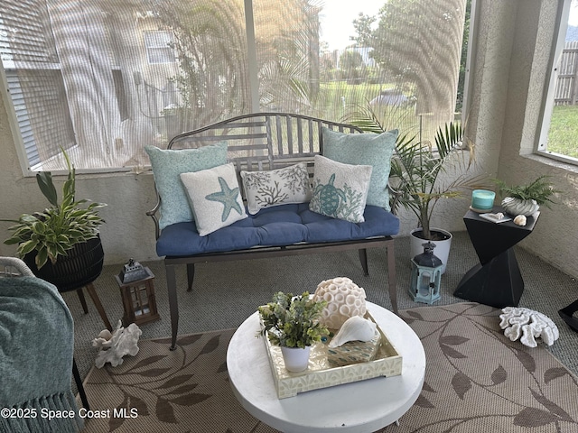 2259 Cogan Dr, Palm Bay, FL 32909 - sunroom with carpet flooring and a textured wall
