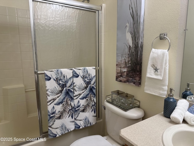 2259 Cogan Dr, Palm Bay, FL 32909 - bathroom featuring an enclosed shower, vanity, and toilet
