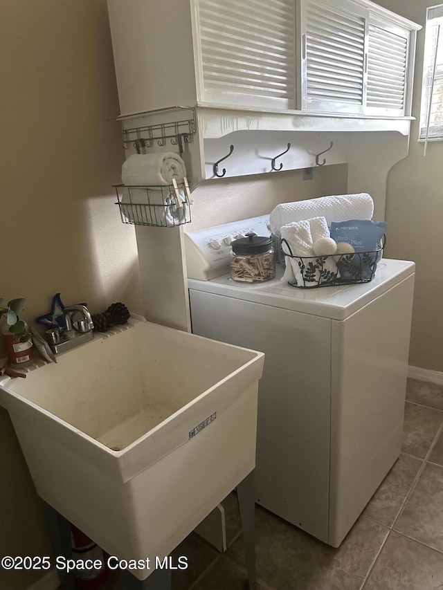 2259 Cogan Dr, Palm Bay, FL 32909 - laundry area with tile patterned floors and washer / clothes dryer