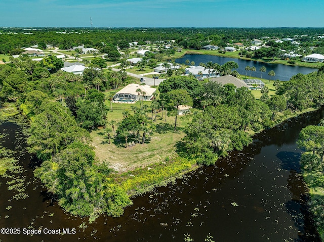 208 Chello Ave, Sebastian, FL 32958 - aerial view of property and surrounding area featuring a nearby body of water and a tree filled landscape