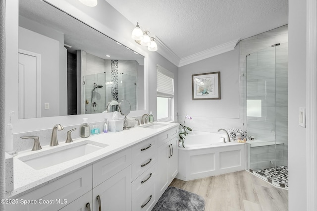 208 Chello Ave, Sebastian, FL 32958 - full bathroom with ornamental molding, a shower stall, a textured ceiling, a bath, and wood finished floors