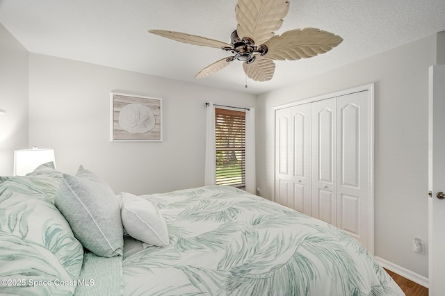 208 Chello Ave, Sebastian, FL 32958 - bedroom featuring a closet, baseboards, wood finished floors, and a ceiling fan