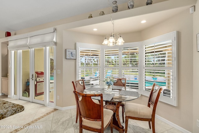 208 Chello Ave, Sebastian, FL 32958 - dining space with a chandelier, baseboards, and recessed lighting