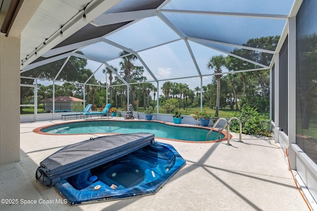 208 Chello Ave, Sebastian, FL 32958 - swimming pool featuring a patio and view of wooded area
