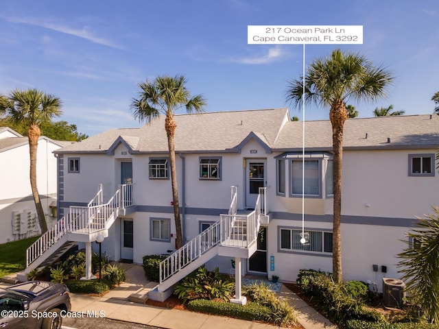 217 Ocean Park Ln Unit V49, Cape Canaveral, FL 32920 - view of property with stairway and central air condition unit