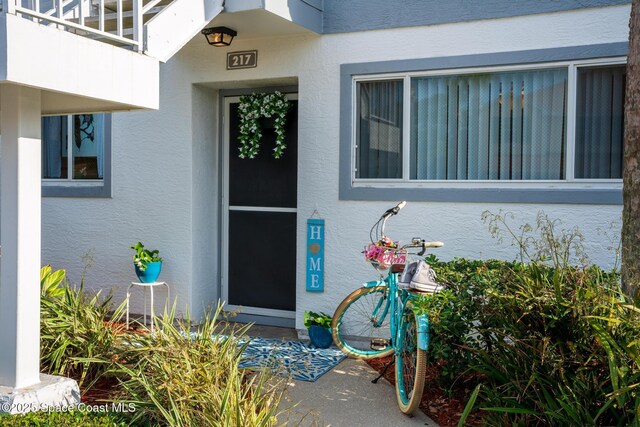 217 Ocean Park Ln Unit V49, Cape Canaveral, FL 32920 - view of exterior entry featuring stucco siding