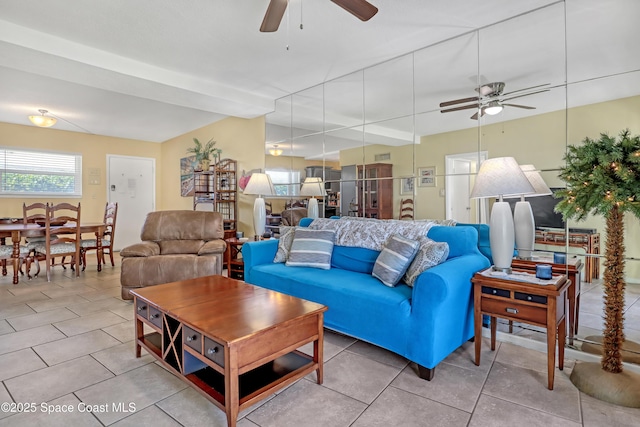 4000 Ocean Beach Blvd Unit 1J, Cocoa Beach, FL 32931 - living room with a ceiling fan and tile patterned floors