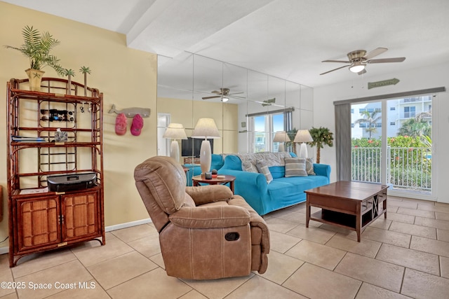 4000 Ocean Beach Blvd Unit 1J, Cocoa Beach, FL 32931 - living area featuring ceiling fan and light tile patterned flooring