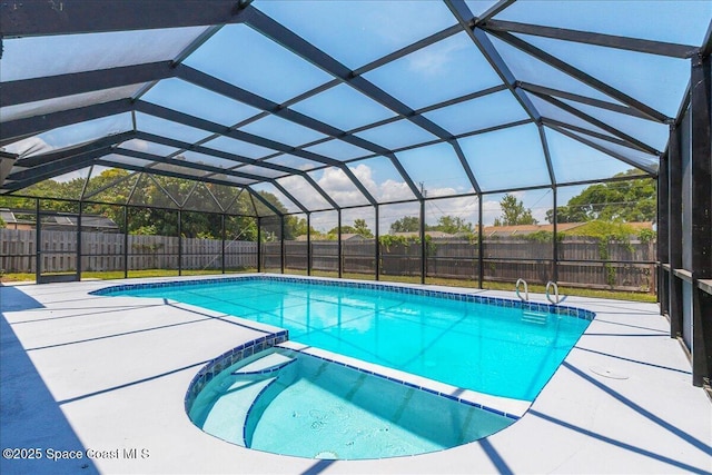 1020 Sycamore Dr, Rockledge, FL 32955 - view of swimming pool featuring a pool with connected hot tub, a fenced backyard, a patio area, and glass enclosure