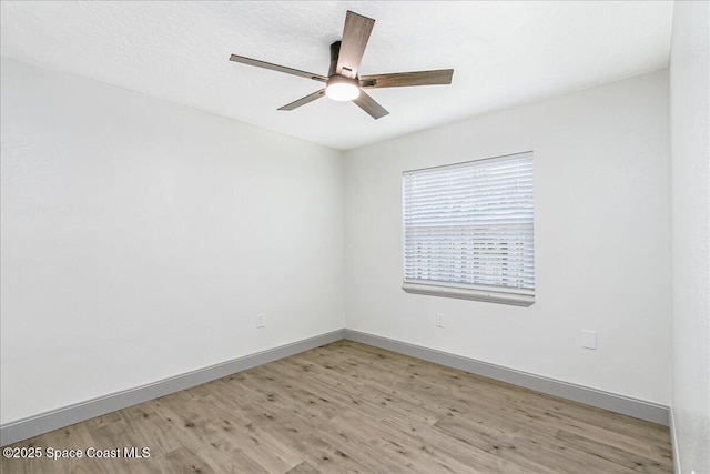 1020 Sycamore Dr, Rockledge, FL 32955 - empty room featuring light wood finished floors, ceiling fan, and baseboards
