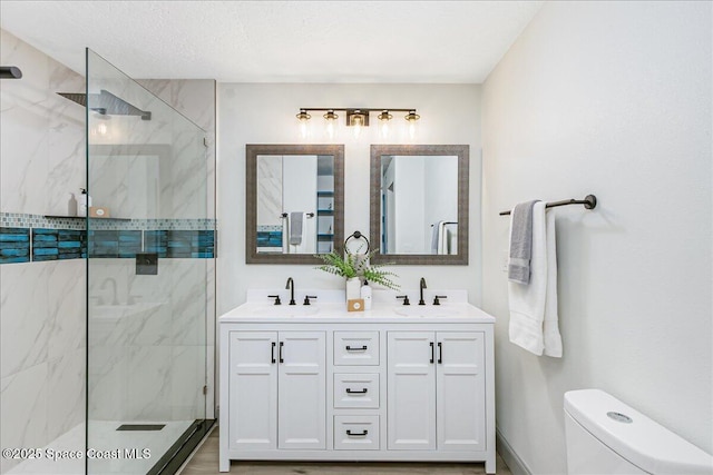 1020 Sycamore Dr, Rockledge, FL 32955 - full bath featuring a marble finish shower, double vanity, and toilet