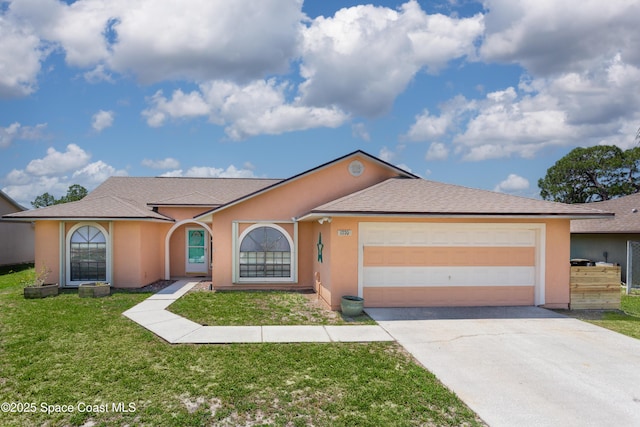 1770 Monrovia St NW, Palm Bay, FL 32907 - view of front of property featuring concrete driveway, an attached garage, a front yard, and stucco siding