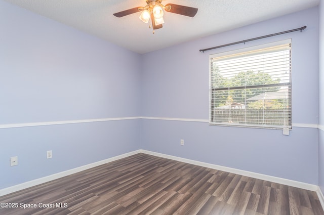 1770 Monrovia St NW, Palm Bay, FL 32907 - empty room with dark wood-type flooring, a ceiling fan, and baseboards