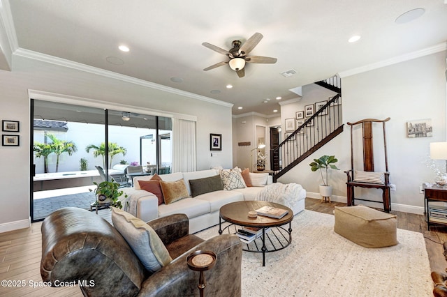 2291 Trava Ln, Melbourne, FL 32940 - living room with wood finished floors, stairs, a ceiling fan, baseboards, and recessed lighting