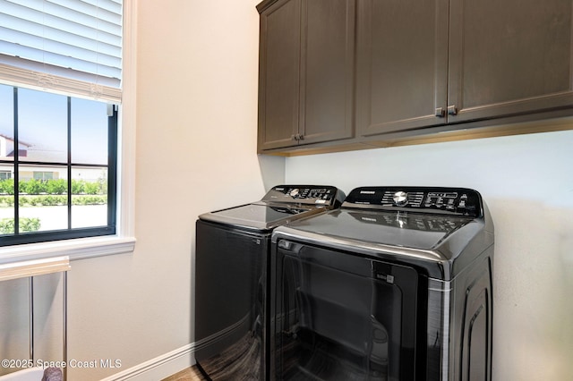 2291 Trava Ln, Melbourne, FL 32940 - laundry room featuring washer and dryer, cabinet space, and baseboards