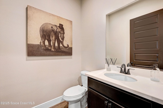 2291 Trava Ln, Melbourne, FL 32940 - bathroom featuring vanity, toilet, and baseboards
