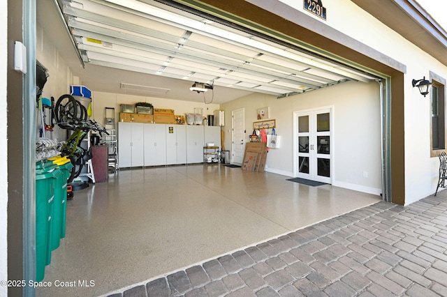 2291 Trava Ln, Melbourne, FL 32940 - garage with french doors and a garage door opener