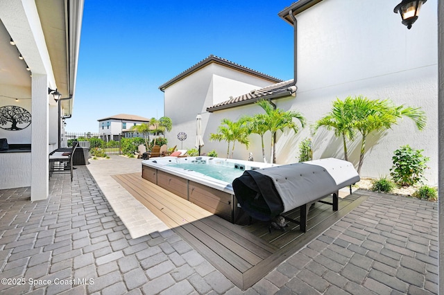 2291 Trava Ln, Melbourne, FL 32940 - view of patio with an outdoor hot tub and a grill